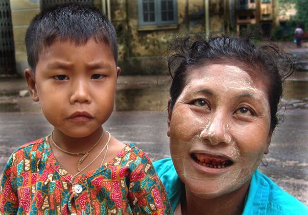 Burmese woman with teeth stained in red